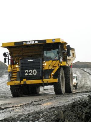 Huge Caterpillar truck being supported by one of the Miller Argent Land Rover Defenders (fitted with SuperPro bushes) Huge Caterpillar truck being supported by one of the Miller Argent Land Rover Defenders (fitted with SuperPro bushes)